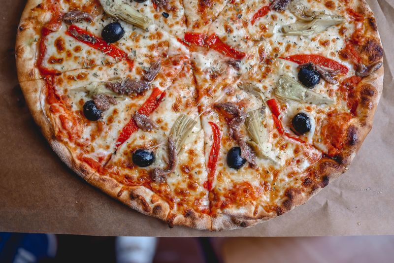 Veggie supreme pizza with roasted peppers at Pizza luce