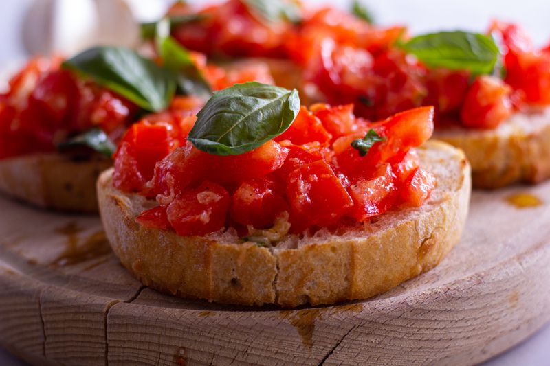 Bruschetta topped with fresh tomatoes and basil